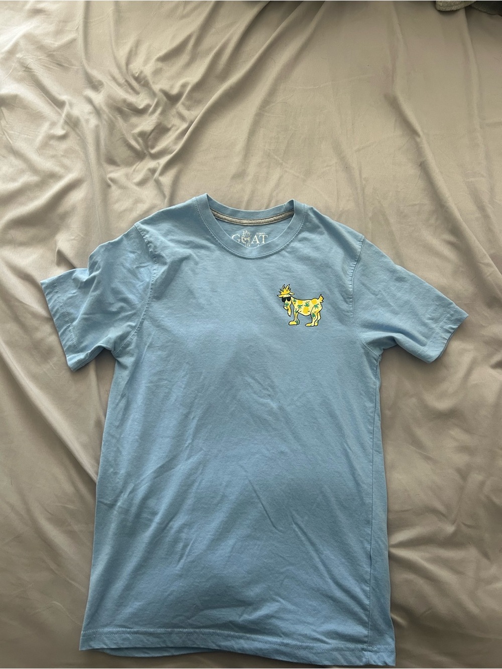 Men's Light Blue Graphic Tee with Yellow Goat Motif